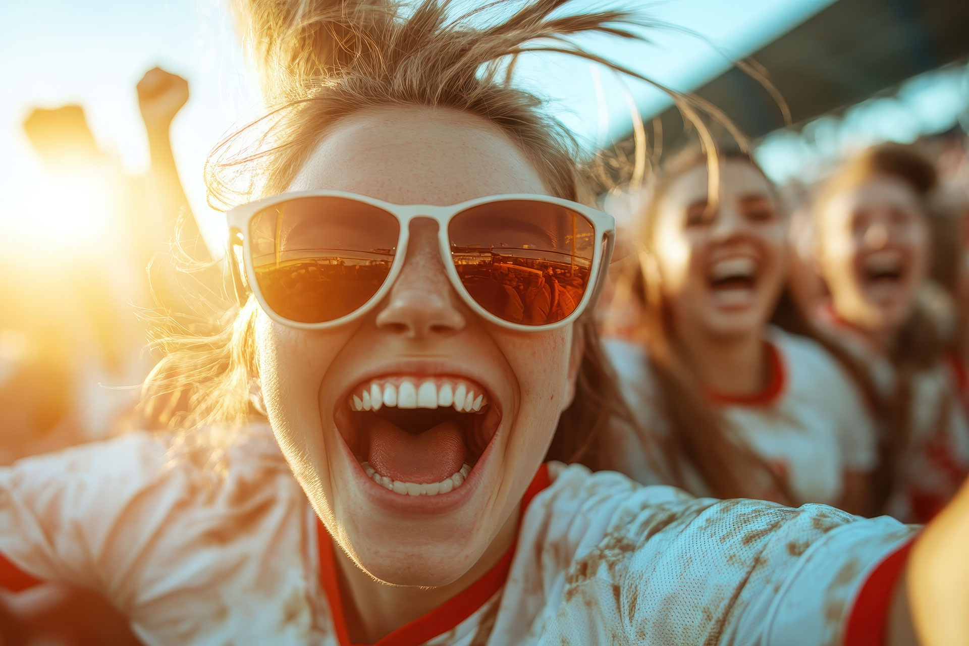 Fans excitedly cheering at an event.